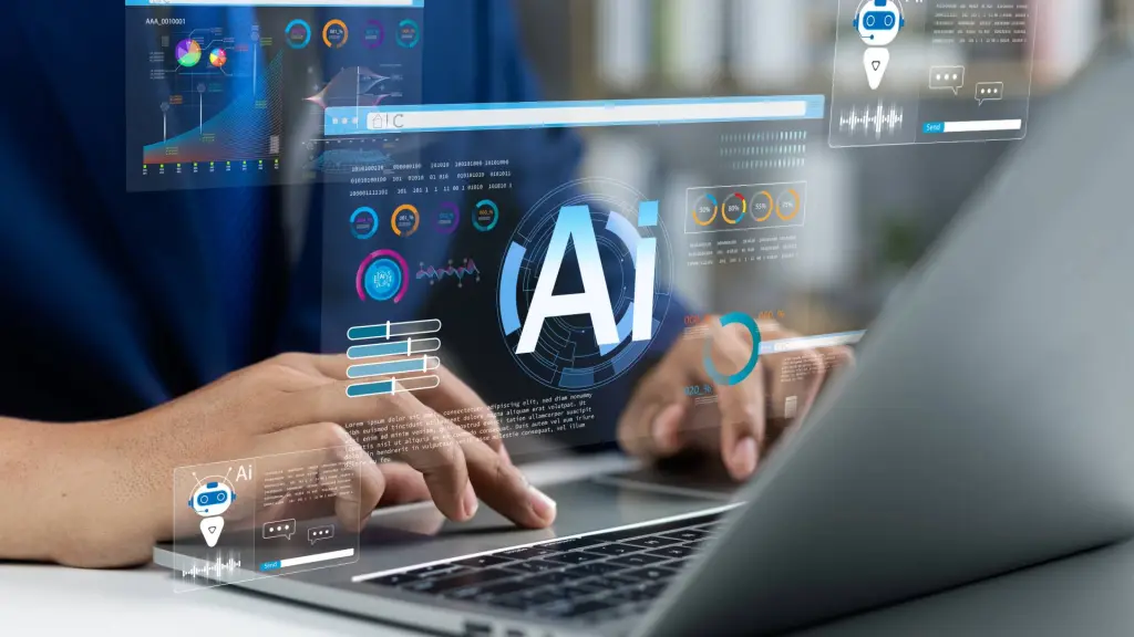 Persona usando un portátil con interfaces holográficas de inteligencia artificial y datos financieros superpuestos